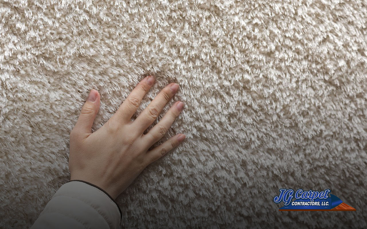 Customer checking carpet quality in an Essex store