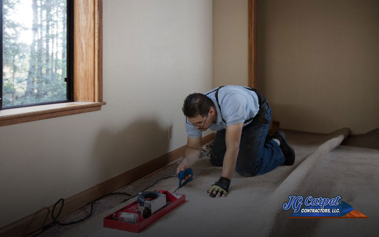 Professional carpet installers securing carpet edges in Essex, MD.